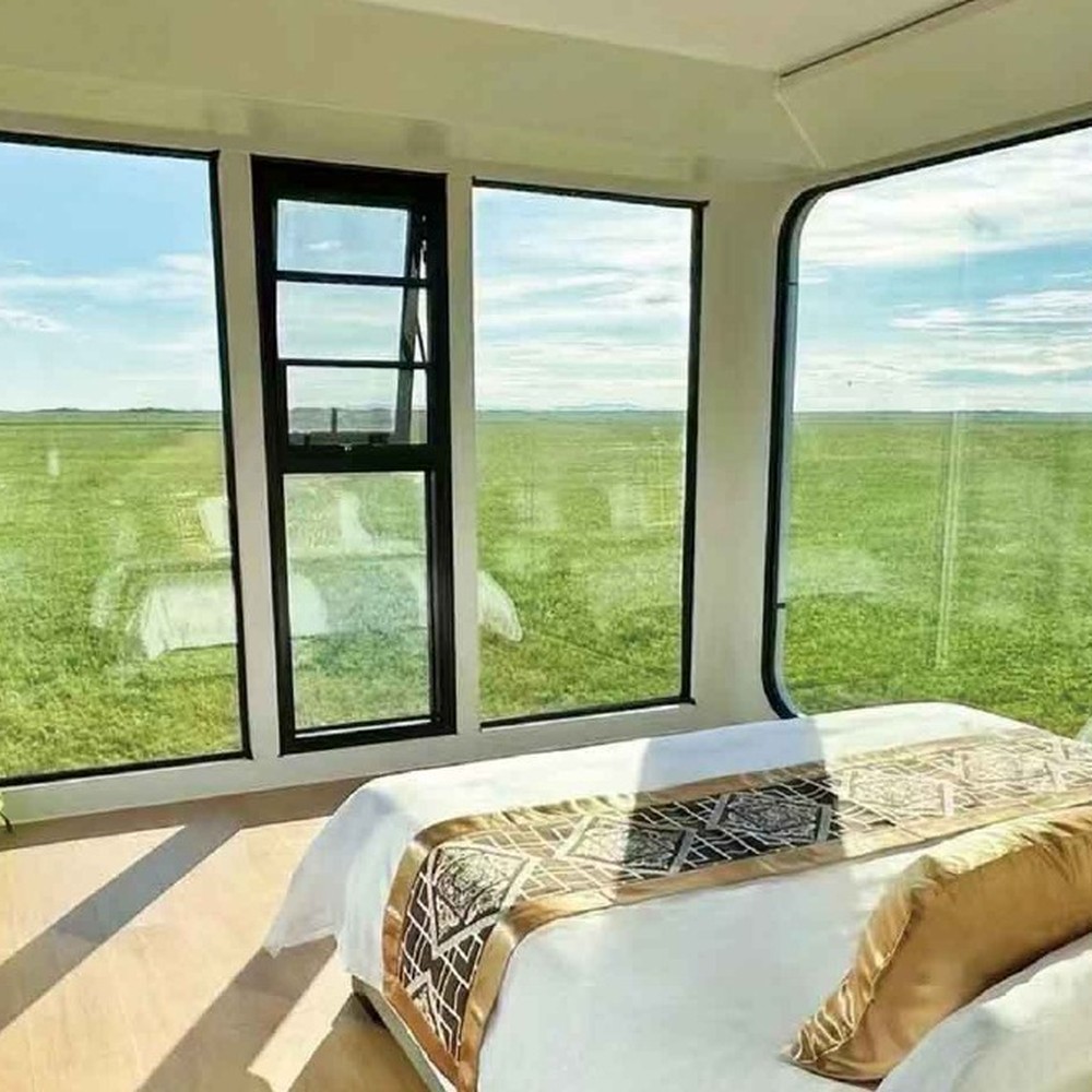 Panoramic bedroom glazing in a space capsule home